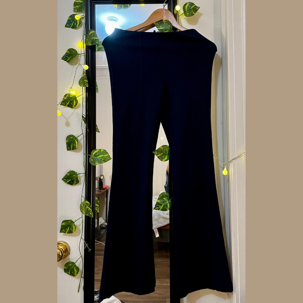 Navy blue flare high-waist stretchy pants.